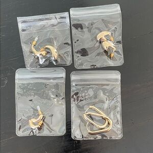 Set of four pairs of gold tone earrings